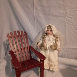 Classic White Porcelain Doll with Red Chair